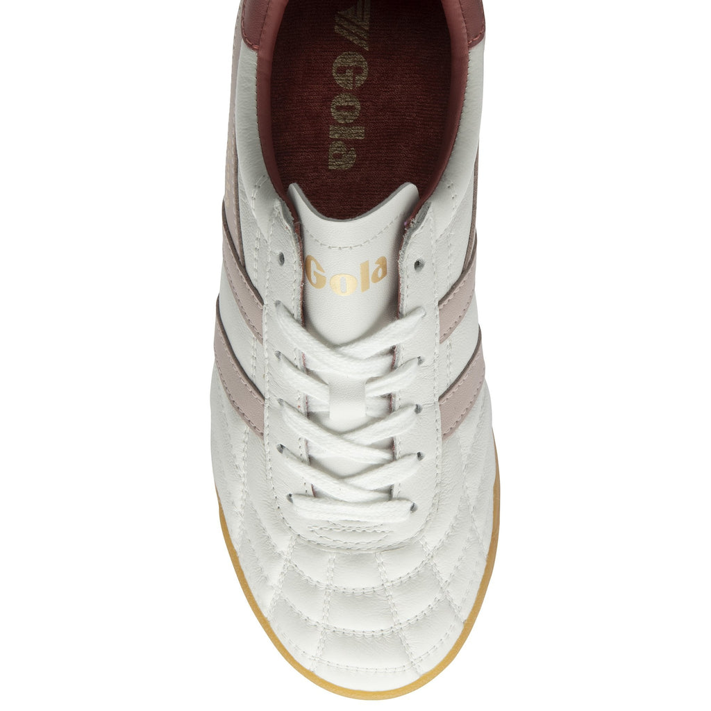 The top-down view of a white Gola women's sneaker with pink stripes and white laces.