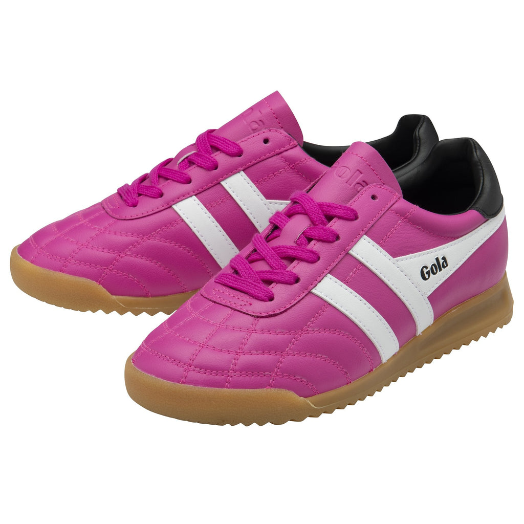 A pair of Gola trainers in bright pink with white stripes and black heel detailing.