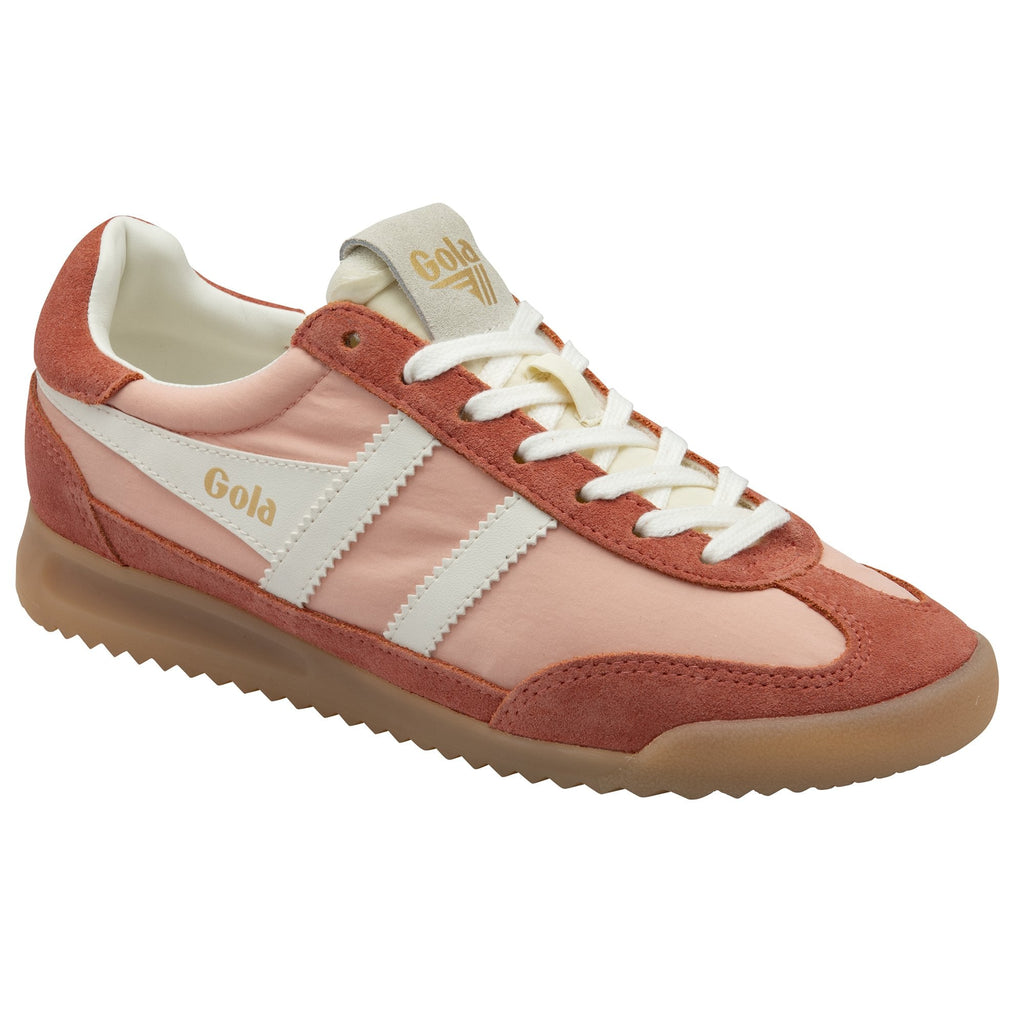 A single Gola women's trainer, in peach and russet with white stripes.