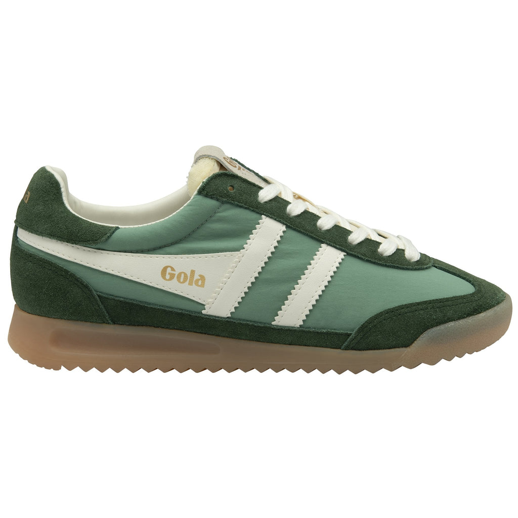 A single Gola Hurricane trainer in green and white, viewed from the side.