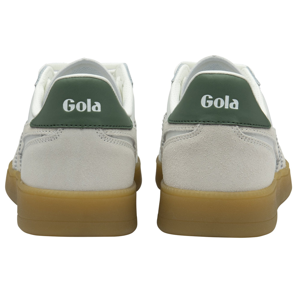 The back view of a pair of white Gola sneakers with green heel tabs and gum soles.