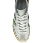 Top-down view of a single white and green Gola sneaker with a gum sole.