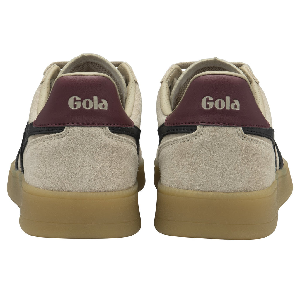 Rear view of a pair of beige Gola sneakers showing maroon heel accents.