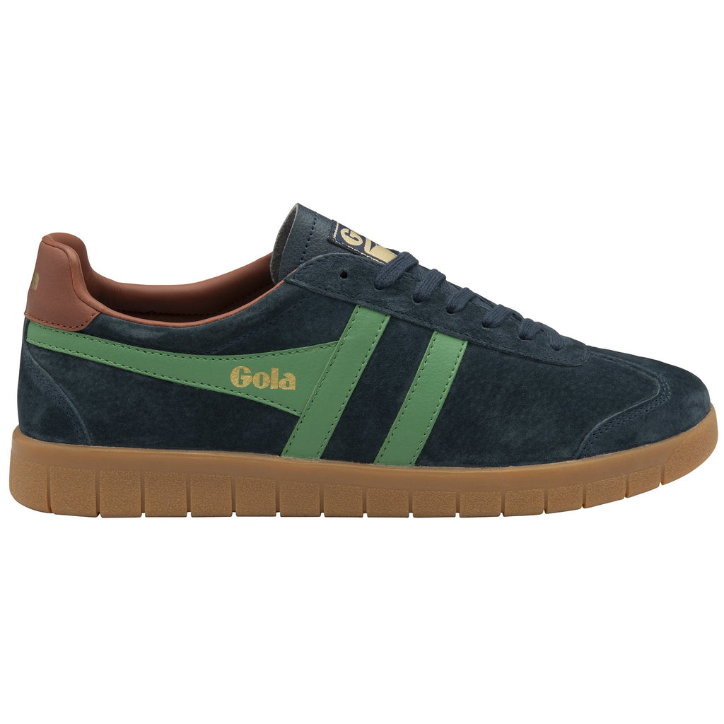 Side view of a dark blue Gola sneaker with green stripes and a brown sole.