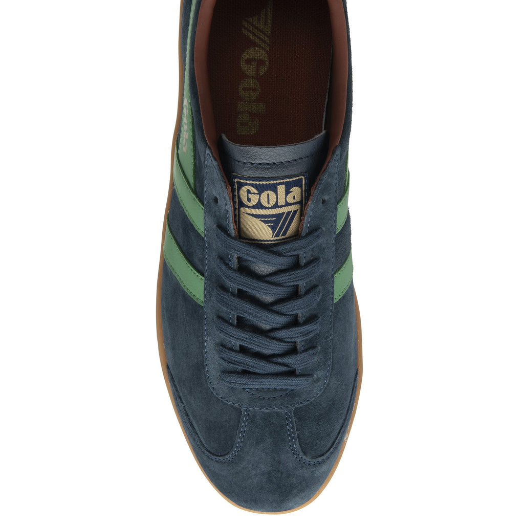 Top down view of a dark blue Gola sneaker with green stripes and brown details.