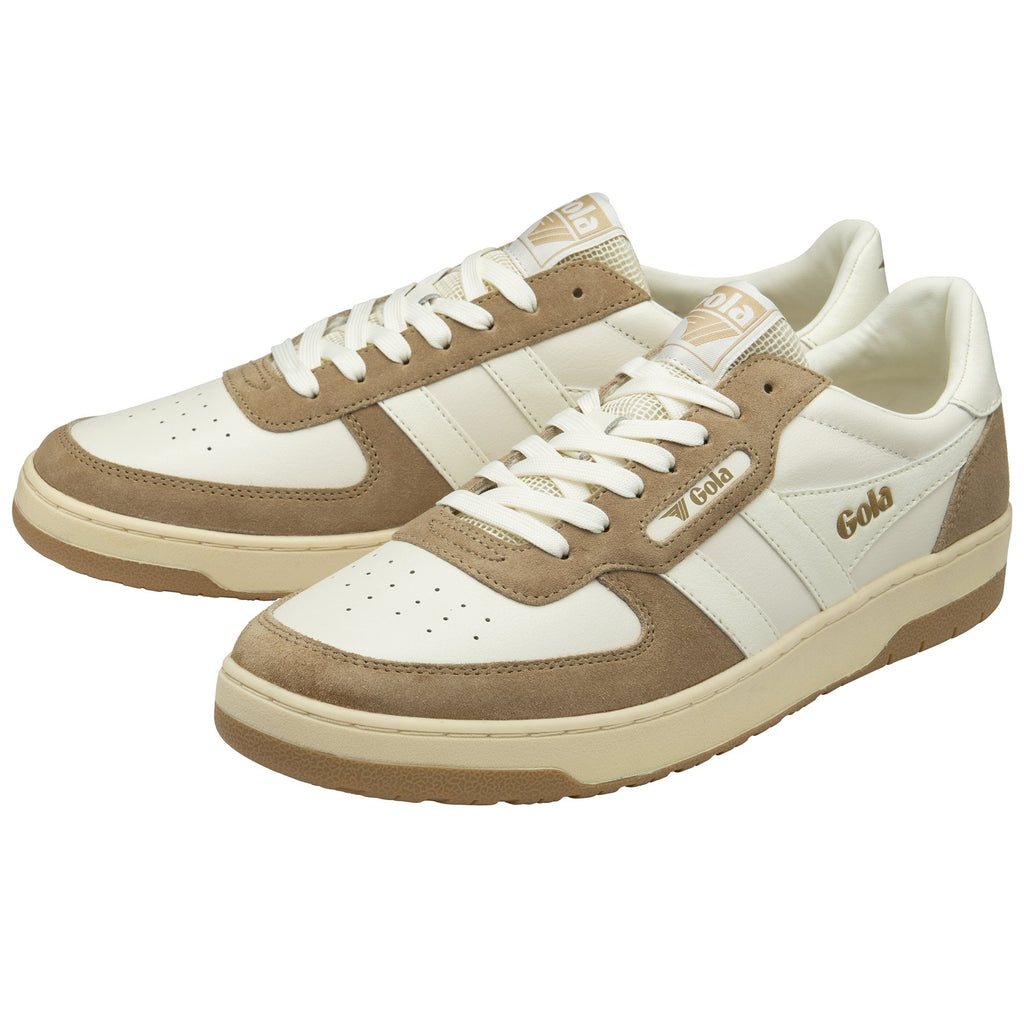 Pair of Gola trainers in off-white and tan suede, seen from an angle.