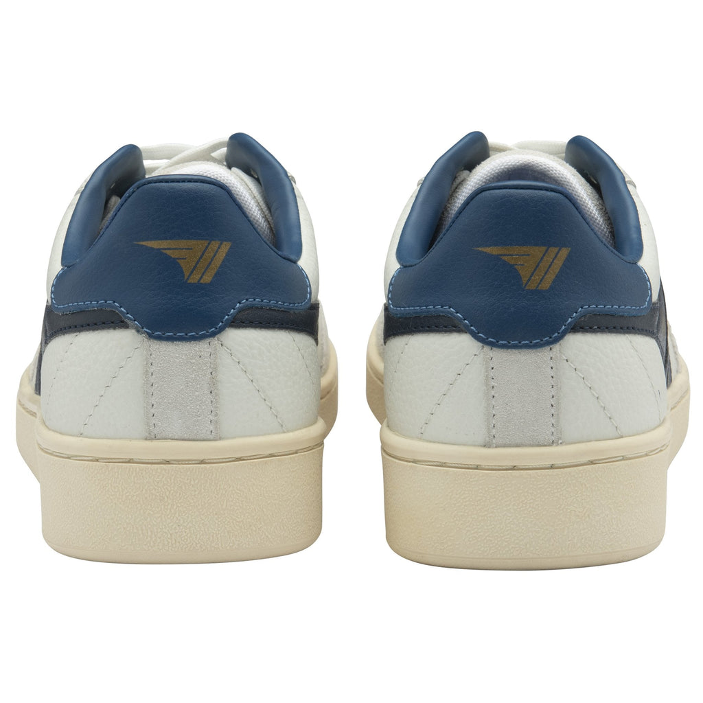 Back view of a pair of white Gola sneakers with navy heels and beige soles. 