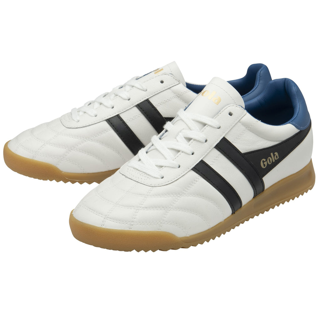Pair of white Gola sneakers with black stripes and gum soles, angled for display.