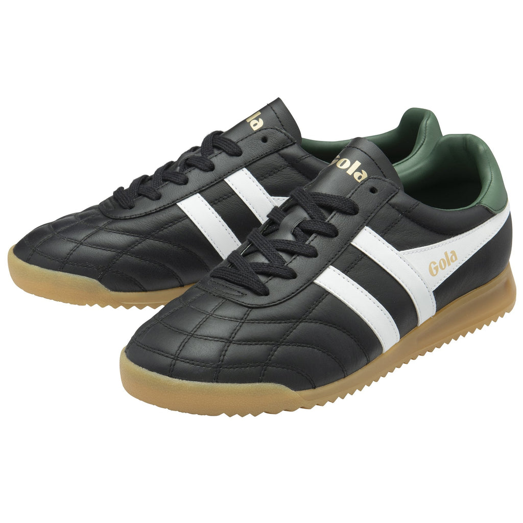 Pair of Gola Quota trainers in black with white stripes, green lining, and gum sole