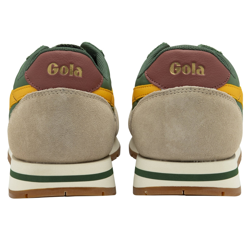 The heels of two Gola men's trainers in green, yellow, and tan.