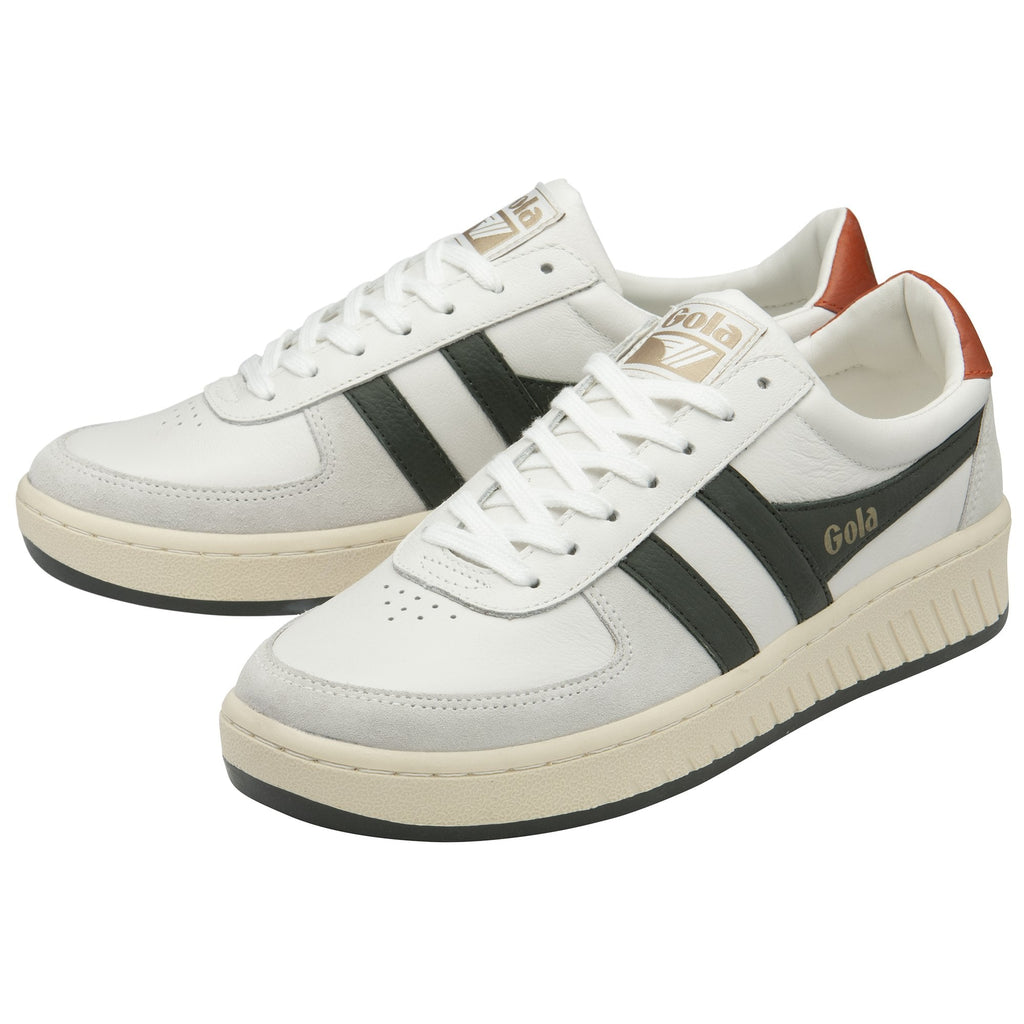 Pair of white Gola sneakers with brown heels and dark green stripes.