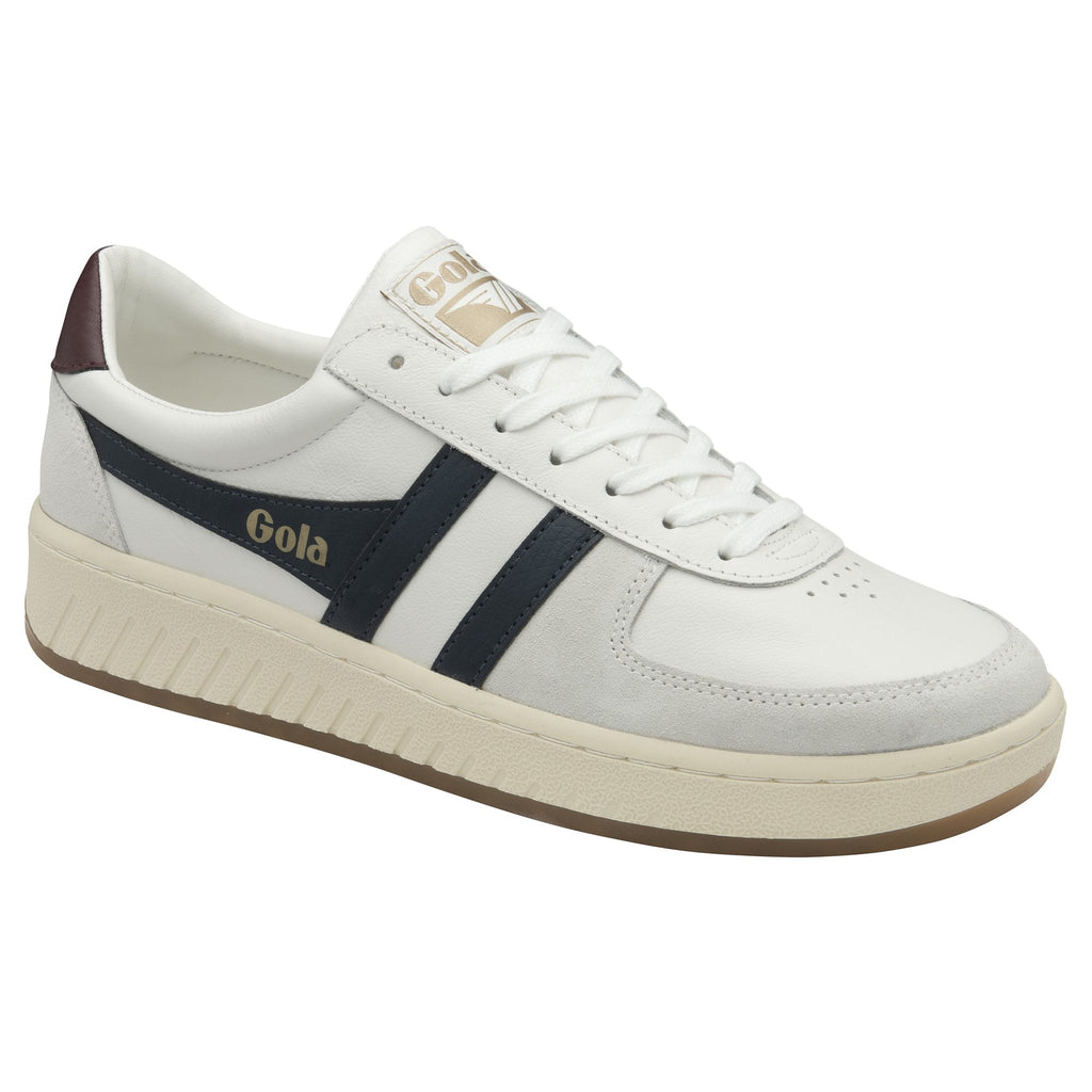 A white Gola low-top sneaker with navy stripes shown at an angle.