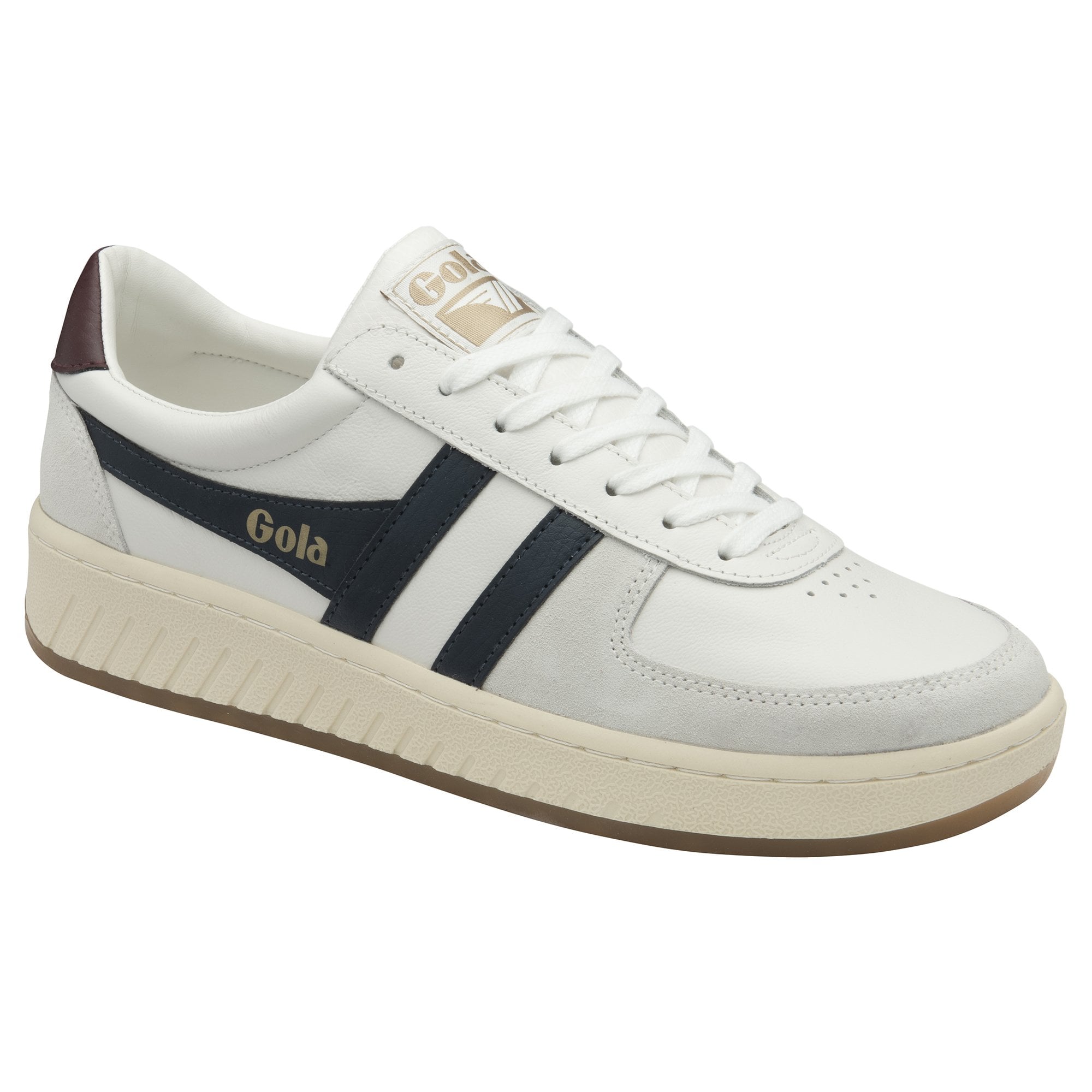 A white Gola low-top sneaker with navy stripes shown at an angle.