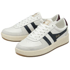 A pair of white Gola low-top sneakers with navy stripes.
