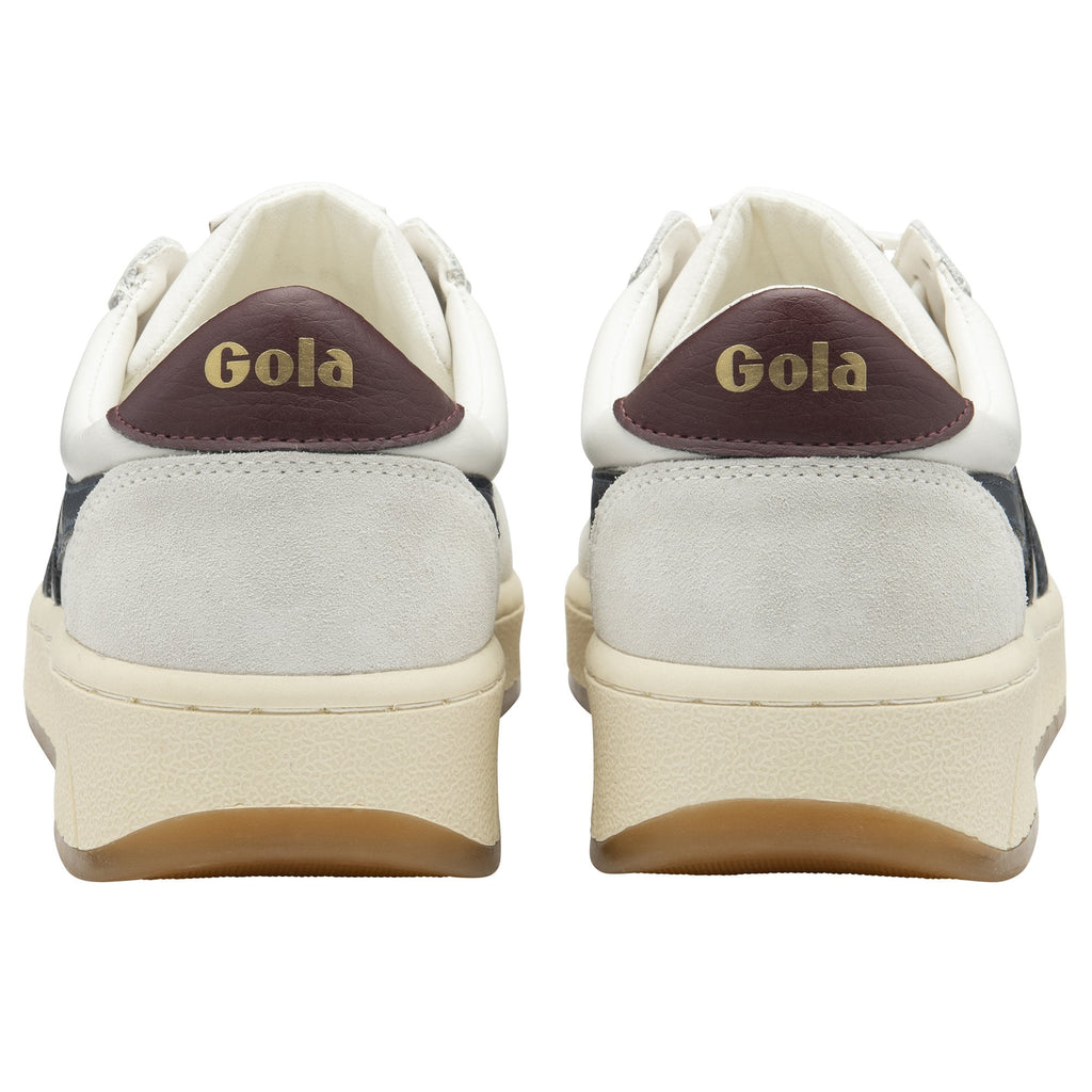 Pair of Gola sneakers, white with dark red heel tabs and gold Gola logo, rear view