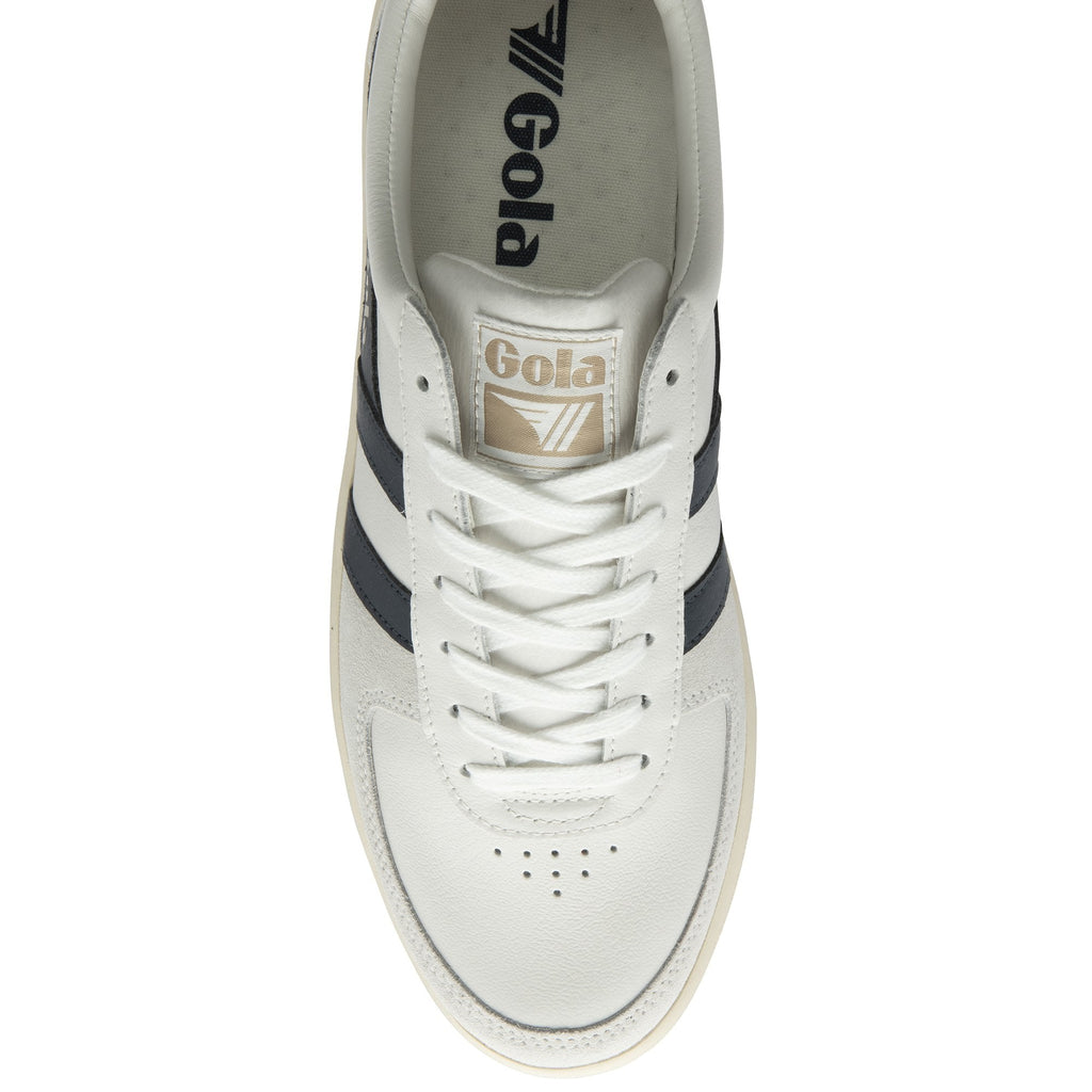 A single white Gola low-top sneaker with navy stripes, viewed from above.