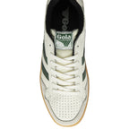 A top-down view of a single white and forest green Gola low-top sneaker with a gum sole.