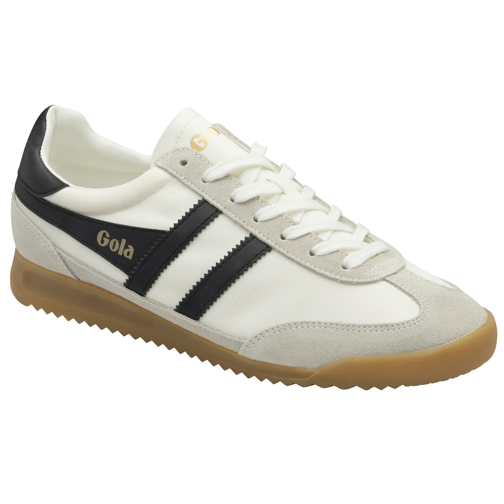 A white Gola Harrier Trainer with black stripes and a gum sole, angled slightly.