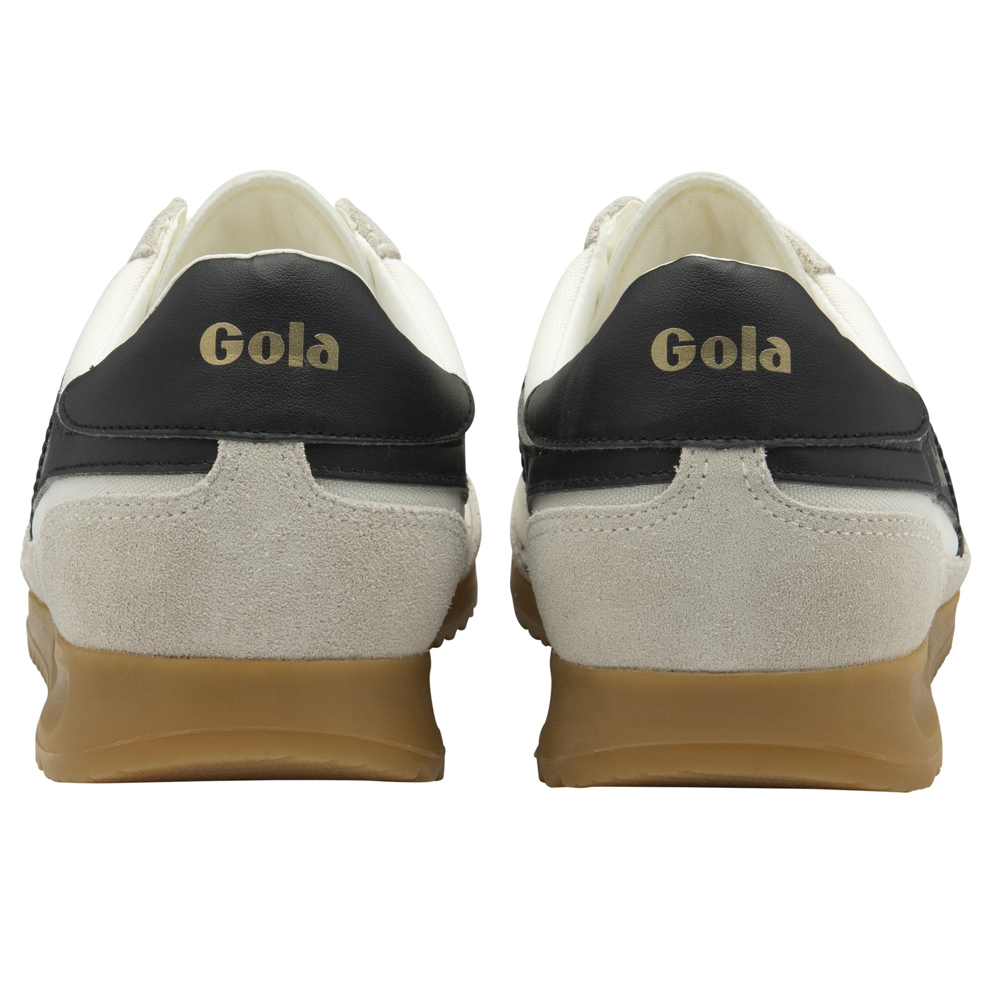 The heels of two white Gola Harrier Trainers with black trim and gum soles.