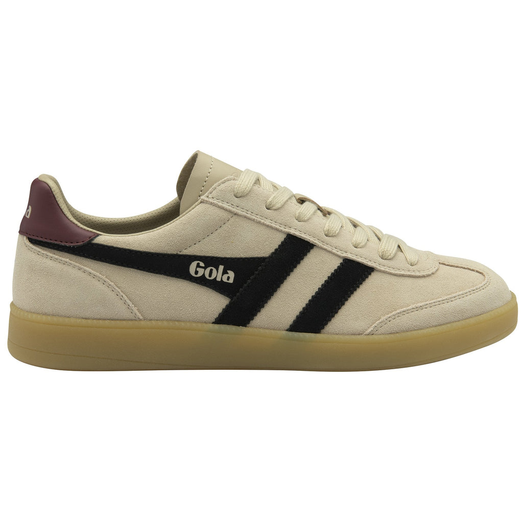 Side view of a beige Gola sneaker with black stripes and a dark red heel accent.