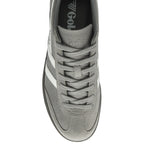 A top-down view of a single gray Gola sneaker with white stripes and gray laces.