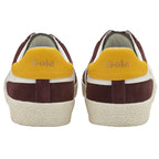 Rear view of two Gola Harrier trainers in maroon suede with yellow heels.