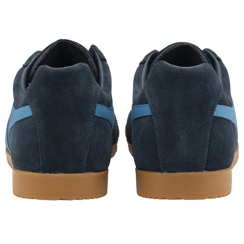 A pair of Gola Harvard shoes, blue suede with light blue stripes and gum soles, shown from the back.
