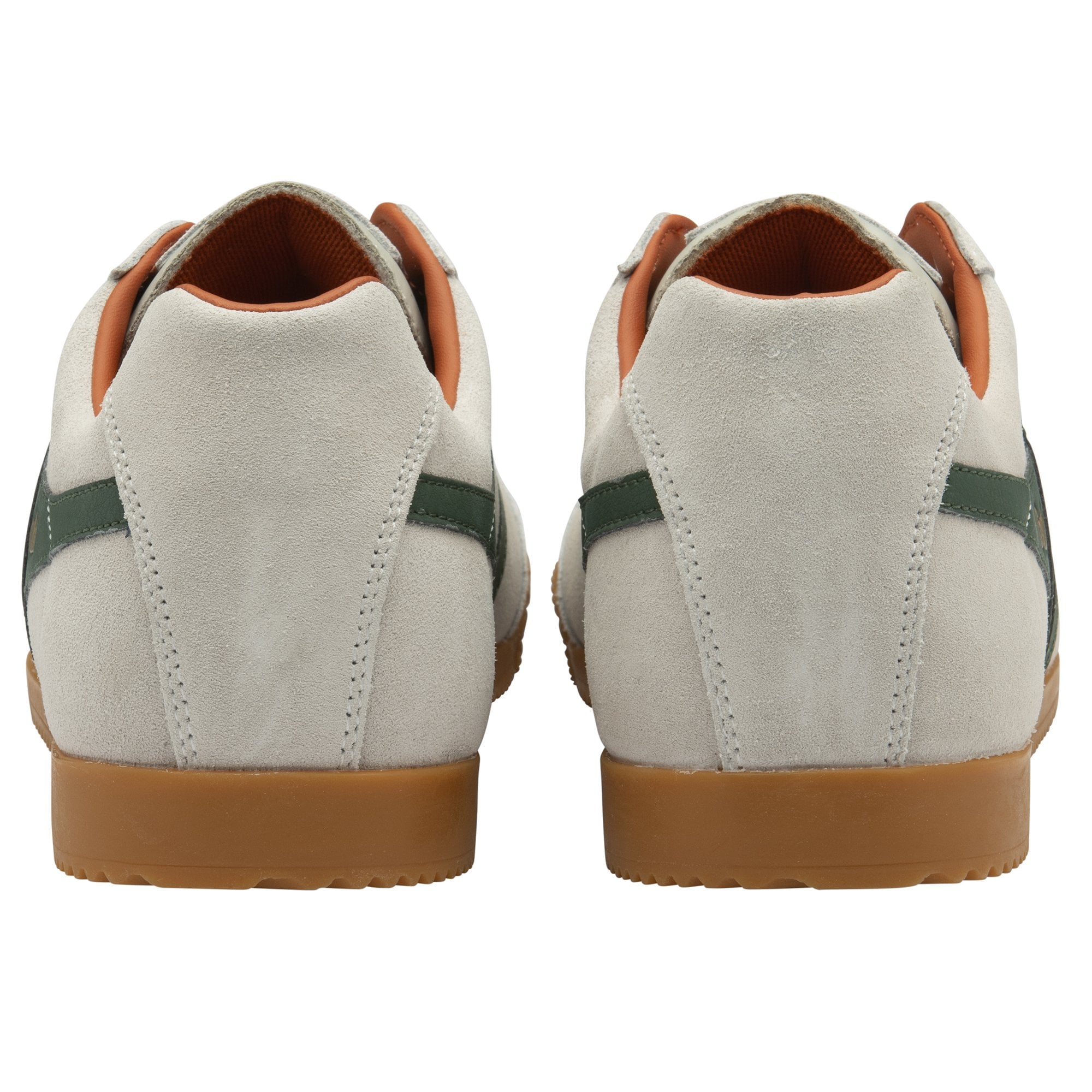 The back view of a pair of white Gola sneakers with green stripes and brown soles.