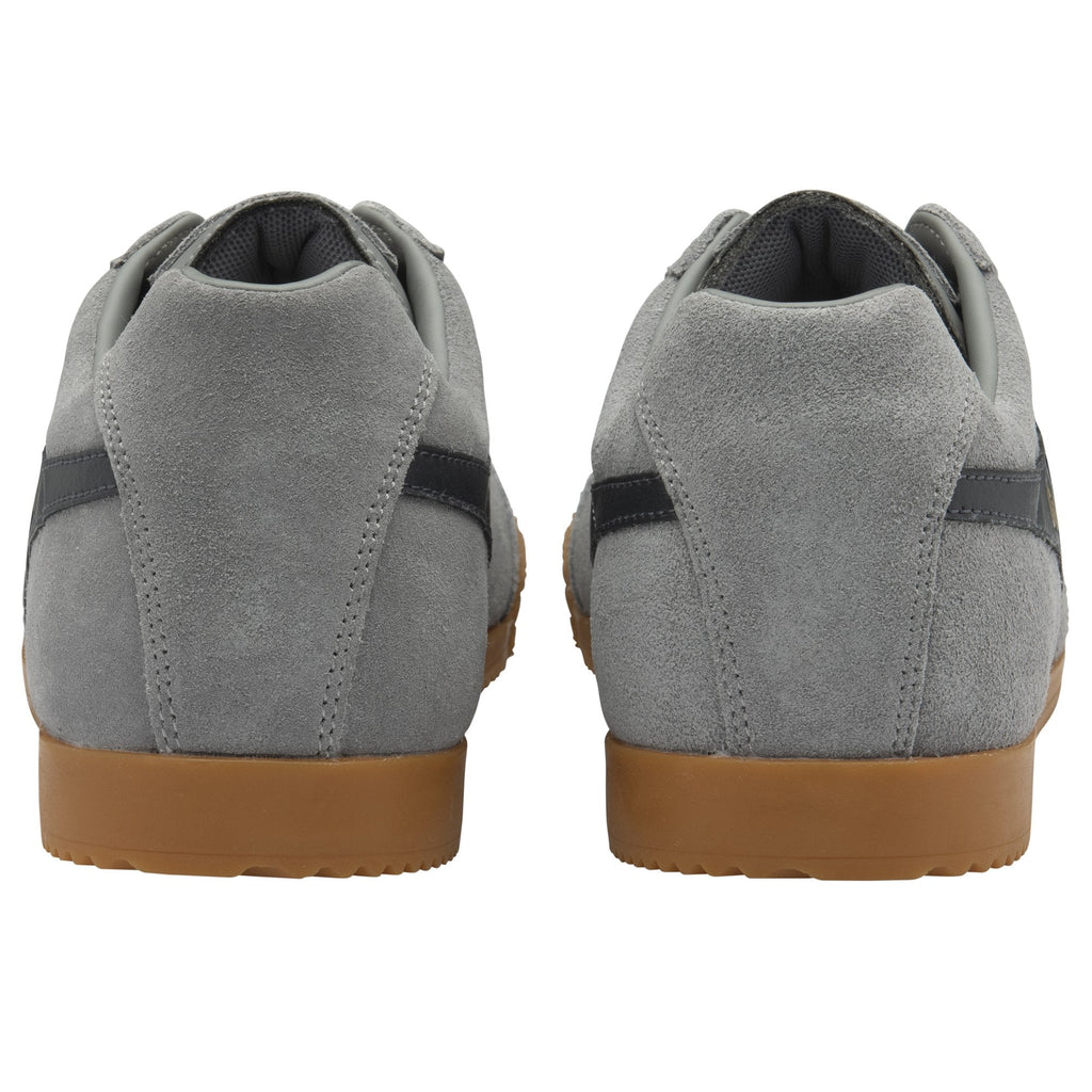 The back of two gray Gola sneakers with dark gray stripes and brown soles.