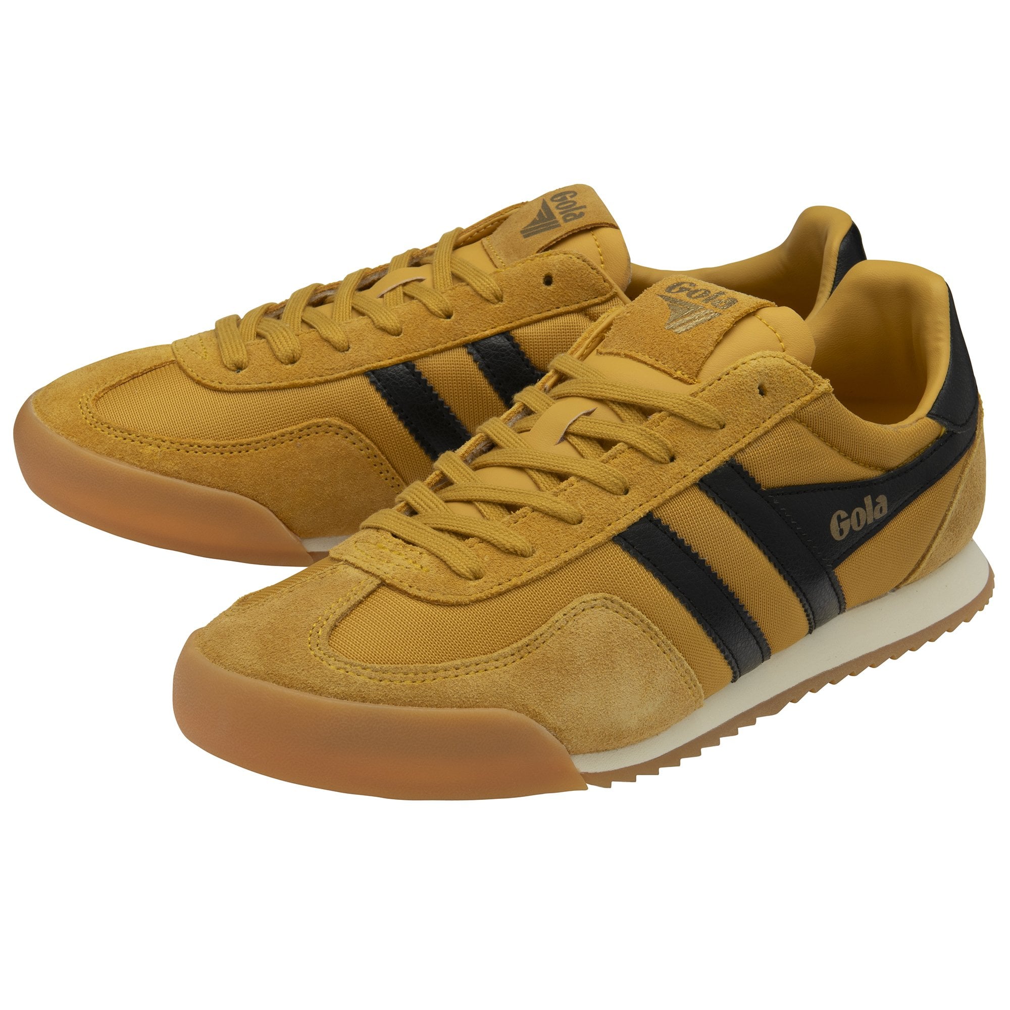 Pair of Gola Harrier suede trainers in sun/black/gum, angled to show both shoes.