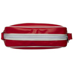 Top view of a red Gola messenger bag, highlighting the white zipper and trim.