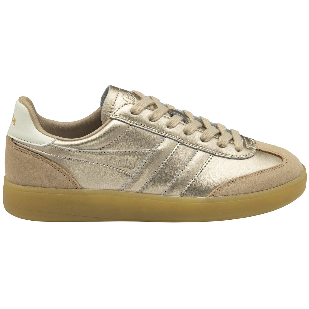 A shiny gold sneaker with tan trim and a gum sole, viewed from the side.