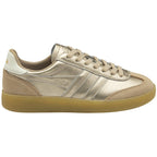 A shiny gold sneaker with tan trim and a gum sole, viewed from the side.