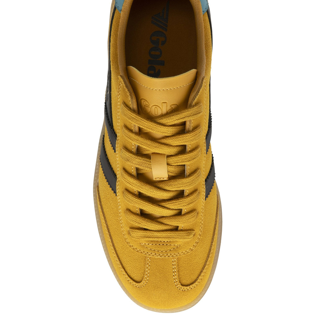Top-down view of a Gola shoe with yellow laces and brown sole.