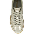 Top-down view of a shiny gold Gola sneaker with white stripes and matching laces.