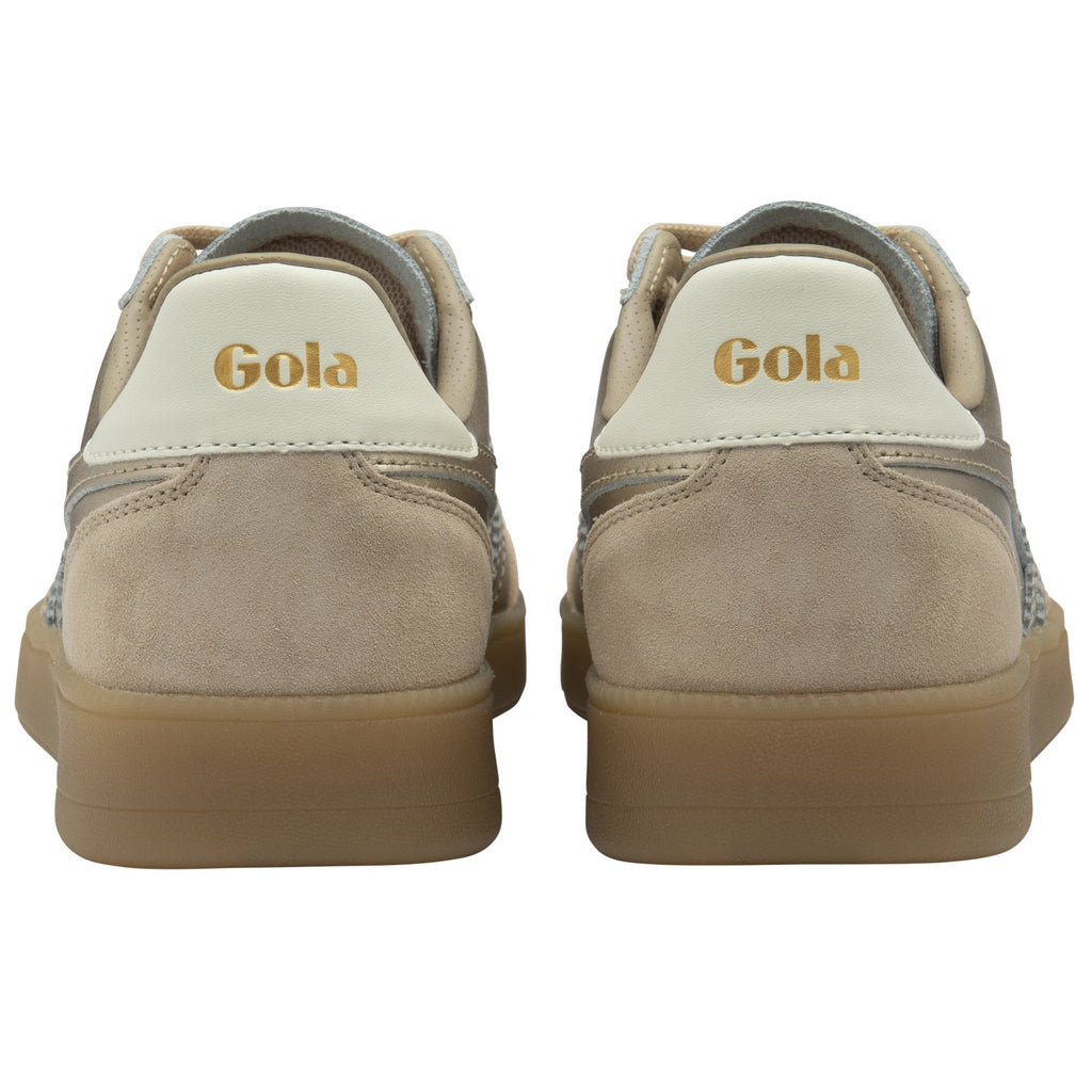 The rear view of two gold and tan sneakers, showing the Gola logo on the heel.