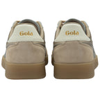 The rear view of two gold and tan sneakers, showing the Gola logo on the heel.