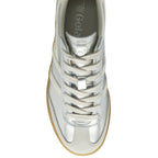Top-down view of a silver Gola sneaker, highlighting the white laces and Gola logo on the tongue.