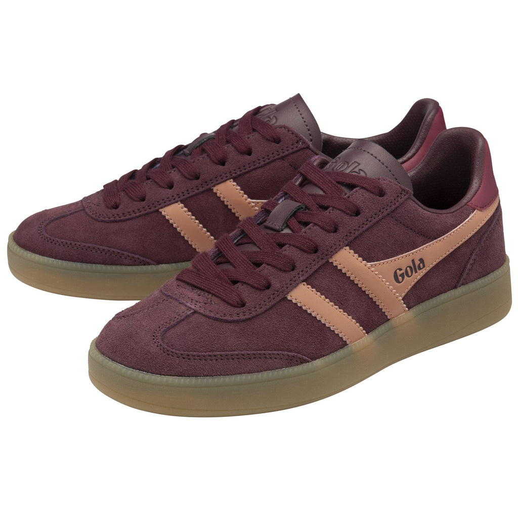 A pair of burgundy Gola sneakers with tan stripes and gum soles, viewed from an angle.