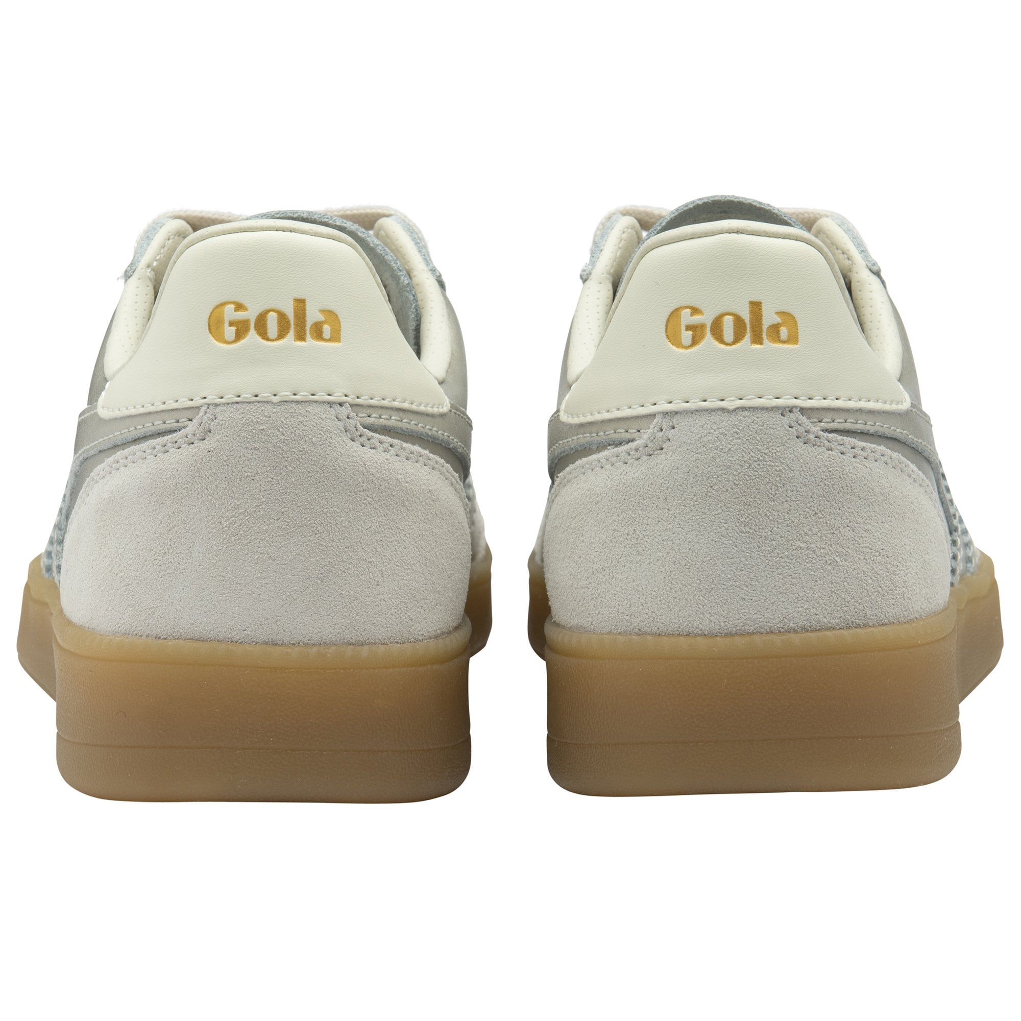 The backs of two silver Gola Daytona trainers with tan soles.