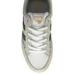 The top-down view of a single white and green Gola sneaker with white laces.