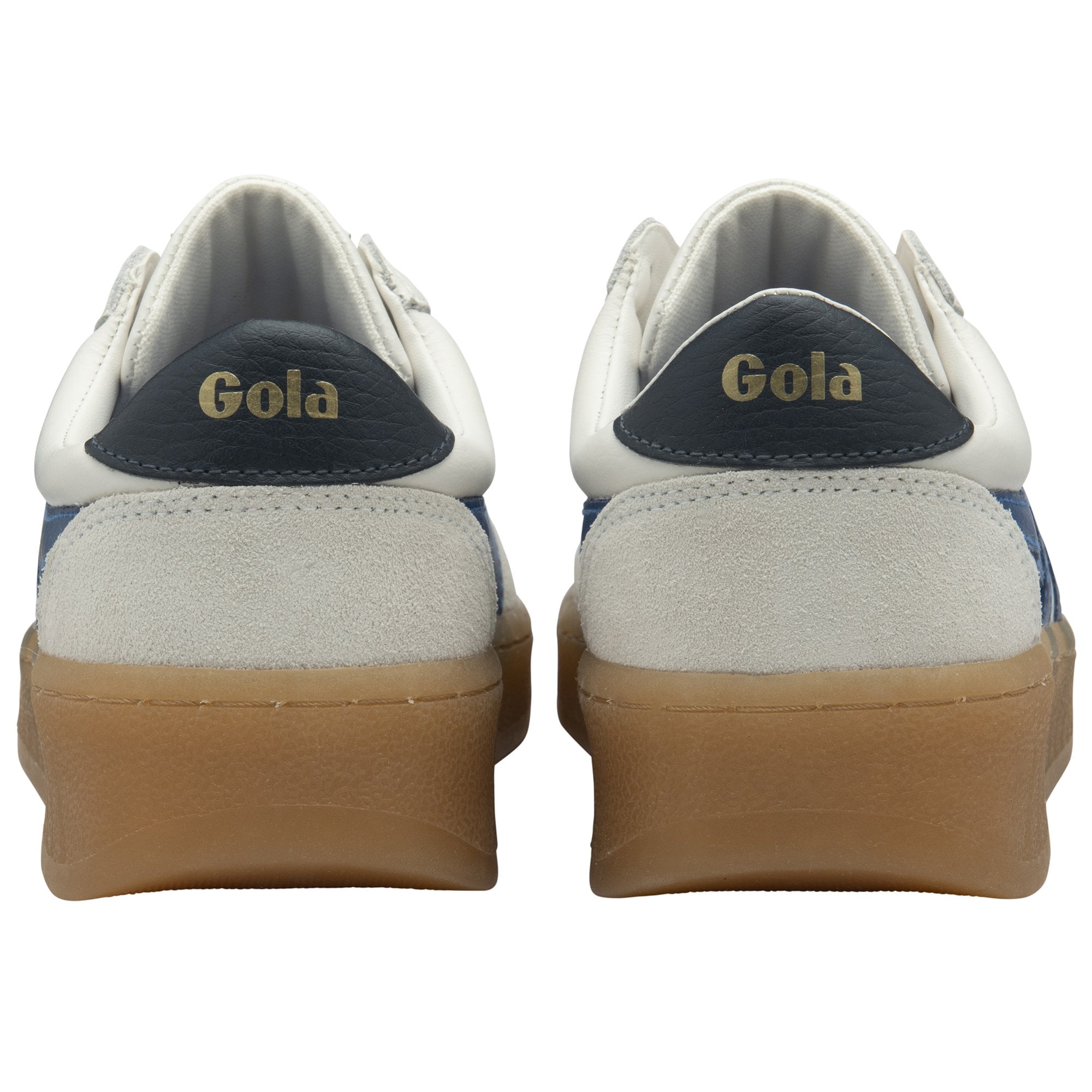 The rear view of a pair of white Gola sneakers with navy heels and brown soles.