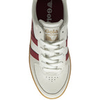 Top-down view of a white Gola sneaker with red stripes, white laces, and a gum sole.