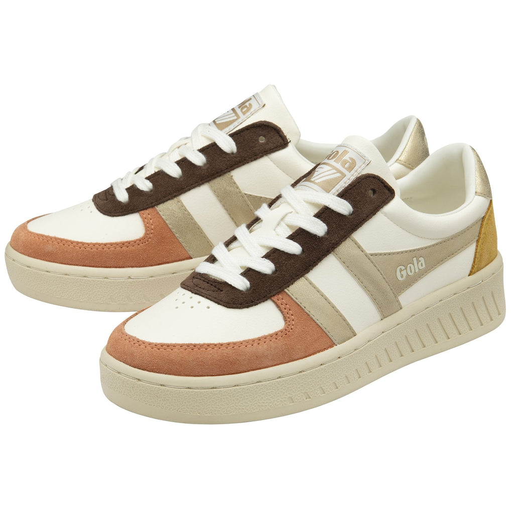 A pair of white Gola women's trainers with brown, gold, and peach accents.