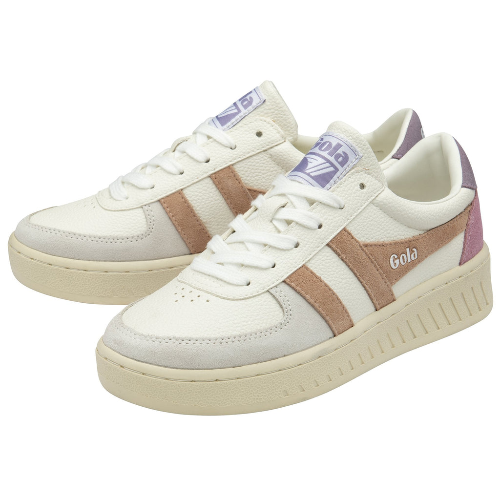 A pair of white Gola sneakers with pink stripes and purple accents.