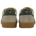 The back view of a pair of Gola low-top sneakers in beige with green heel accents.