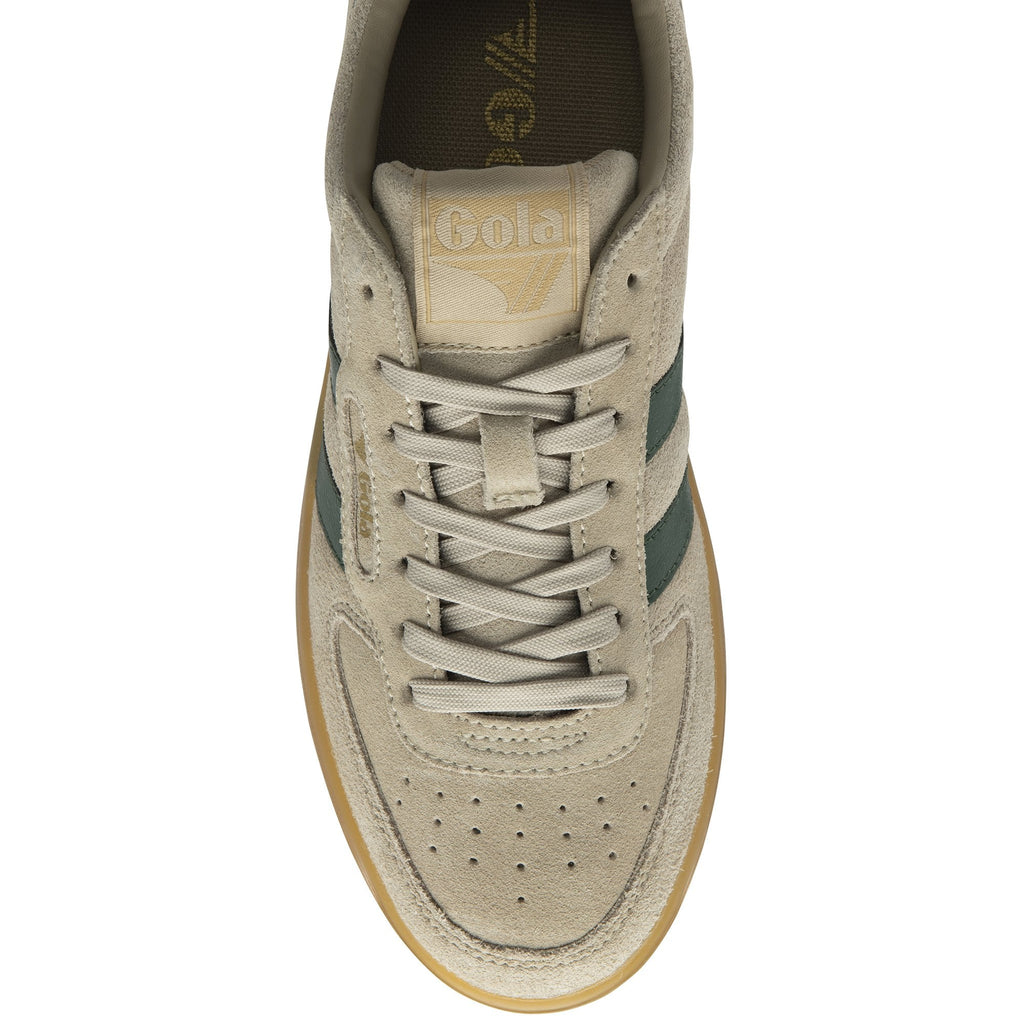 A top-down view of a single Gola low-top sneaker in beige suede with green stripes.