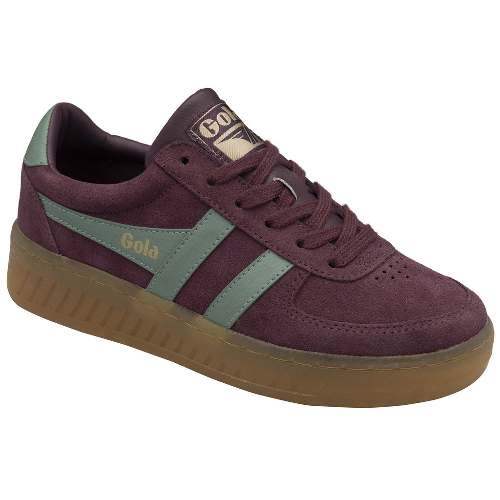 A single Gola low-top sneaker in burgundy with sage green stripes, angled side view.