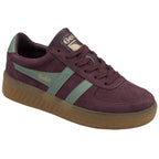 A single Gola low-top sneaker in burgundy with sage green stripes, angled side view.