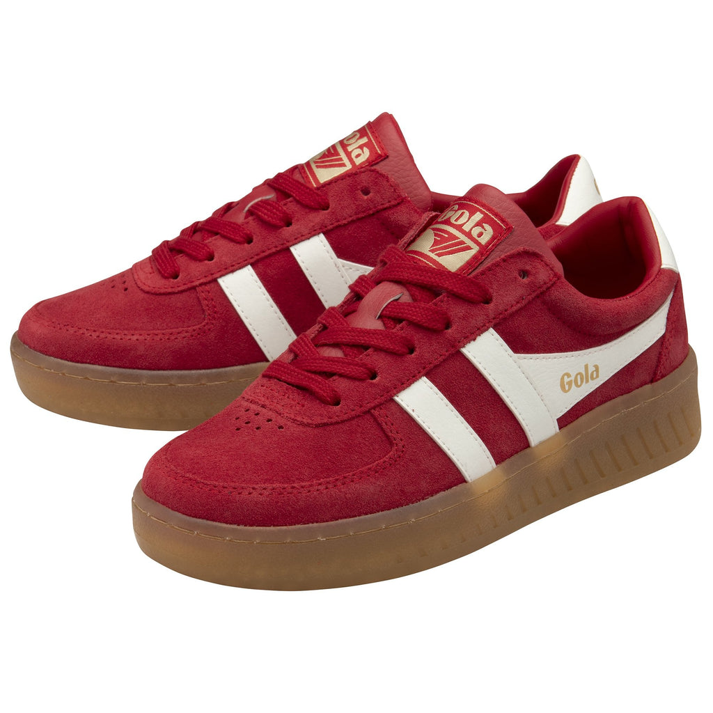 A pair of Gola sneakers in red suede with white side stripes and gum soles.